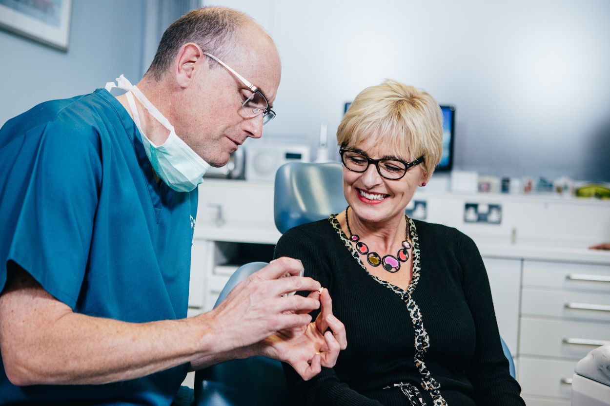 Dentist talking through Implant treatment with patient